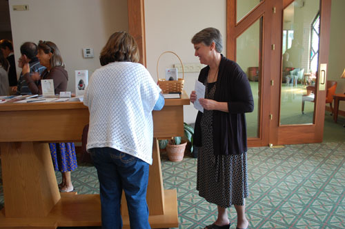 Parishioners signing up for prayer support of Healing Hidden Hurts.